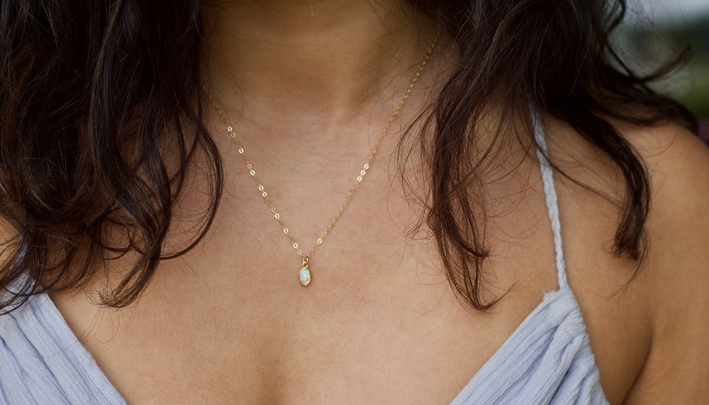 Ultra-tiny white opal necklace available in 14K Gold-Filled or Sterling Silver, featuring a dainty chain for a delicate, feminine touch—perfect for bridesmaids, gifts, or personal use.

